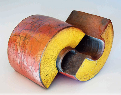 This sculpture by Michael Lancaster was thrown, altered and assembled, then raku fired with ferric chloride fuming.