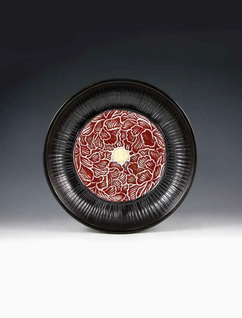 Peony platter, thrown porcelain with carved sprigs, 13 in. (33 cm) in diameter, fired to cone 10 in reduction.