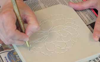 2 Carve the image into the slab, varying the line width and depth.
