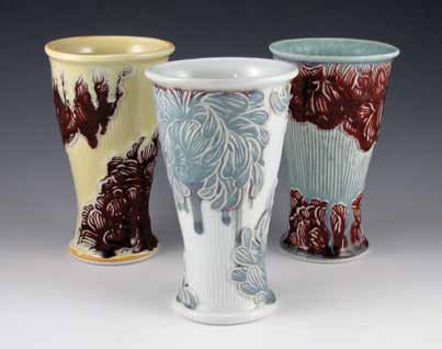 Floral tumblers, to 7 in. (18 cm) in height, slip-cast porcelain, carved sprigs, fired to cone 10 in reduction.