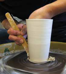 3 Use a wooden knife to trim down the bottom of the tumbler/body.