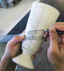 12 Connect the marks on the vertical lines with a pencil and a flexible ruler to guide your carving.