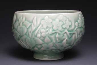 Bowl with flower and leaf pattern, wheel-thrown, carved, and slip-trailed porcelain, celadon glaze, fired to cone 10 in reduc-tion, 2014.