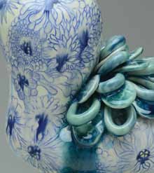 I Think of Blue Flowers, 13 in. (33 cm) in height, coil-built porcelain, tissue paper trans-fers, mishima, underglazes, low-fire glazes, fired in an electric kiln to cone 5, 2014.