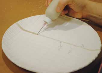 11 After the bisque firing, apply glazes using a slip trailer with a fine needle tip. Fill the incised lines.