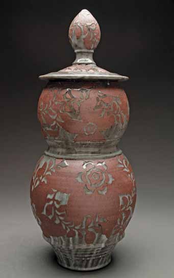 Floral-covered jar, 19 in. (48 cm) in height, iron-rich stoneware, sandblasted, inlaid glaze, fired to cone 9 in reduction.