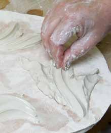 13 Form pieces on a bisque-fired slab using small coils and damp fingers.