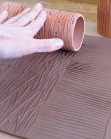 2 Use several cylinders to roll a variety of texture into slabs.