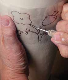 10 Make a template of a drawing on thin, clear acetate and transfer the image onto the piece using a small ball tool.