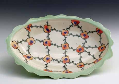 Scalloped Bloom Platter, 14 in. (36 cm) in length, handbuilt porcelain, mishima, water etching, glaze, fired to cone 6. All photos: John Schnick.