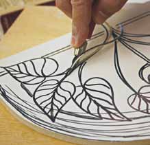 1 Sketch a design on the EZ Carve rubber, then use a lino cutter to carve the pattern.