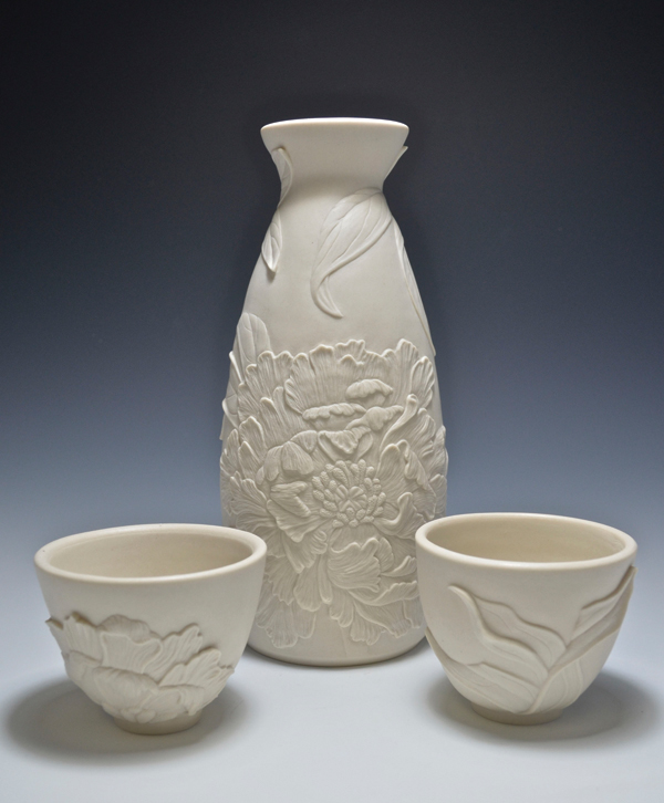 Peony sake set (after Tanigami Konan), 7¾ in. (20 cm) in height, wheel-thrown and hand-carved porcelain, unglazed exterior, hand polished, fired to cone 6 in oxidation.