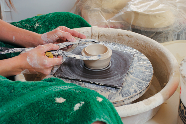 1. After throwing the teacup, throw a bowl-shaped form for the lid to fit it. Then split the rim to create a flange.