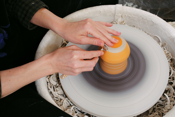 11. Once the underglaze is dry to the touch, trim away any excess that got onto the foot-ring while decorating.