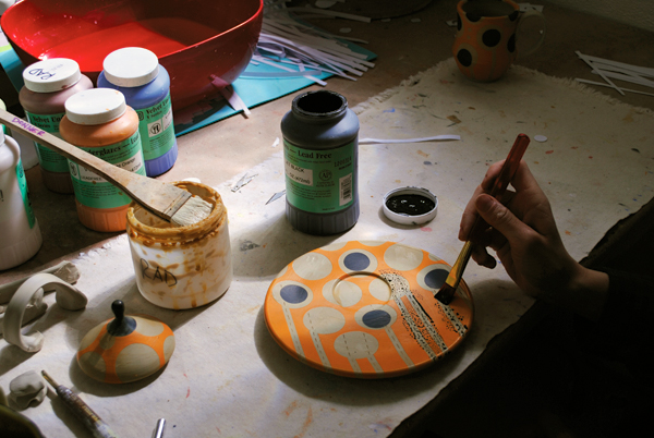 13. Create mishima inlay by filling the lines with underglaze. Remove any excess with a sponge, then touch up bare spots.