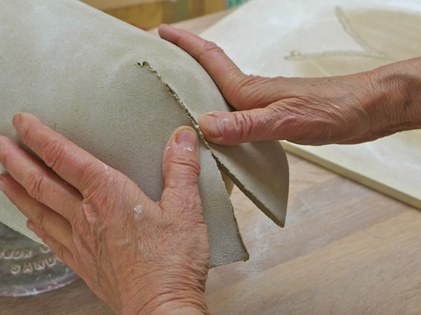 4. Press the seams of the slabs together so they conform to the shape of the mold.