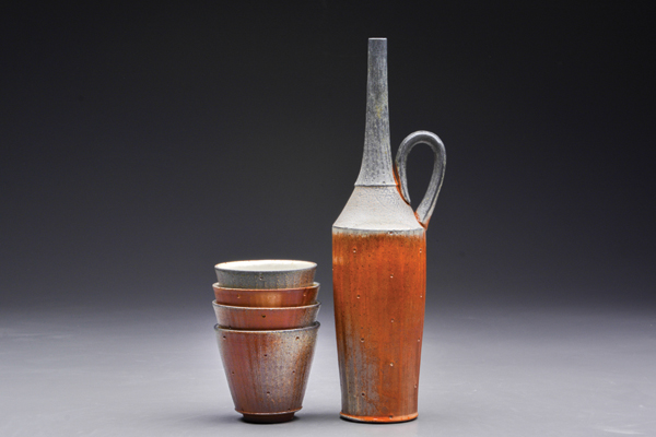 2 Stuart Gair’s liquor set, 7 in. (18 cm) in height, stoneware, carved, flashing slip, soda fired to cone 11, 2014.