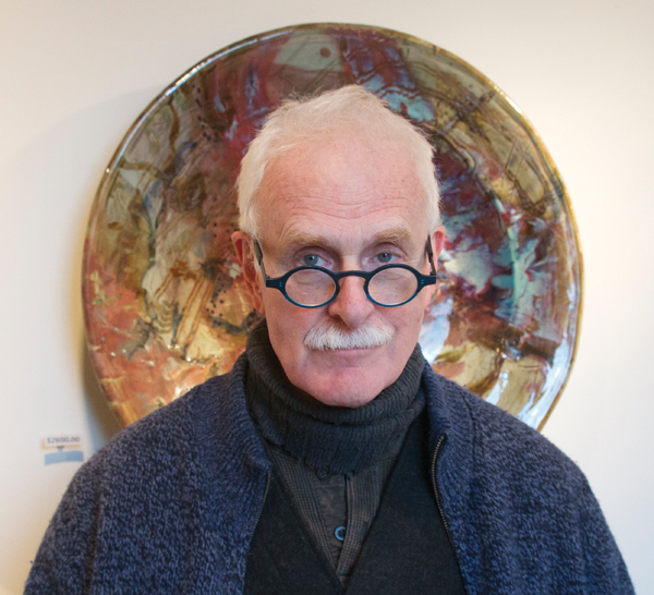 1 John Glick pictured in front of one of his large platters. Photo: Hunt Studios.