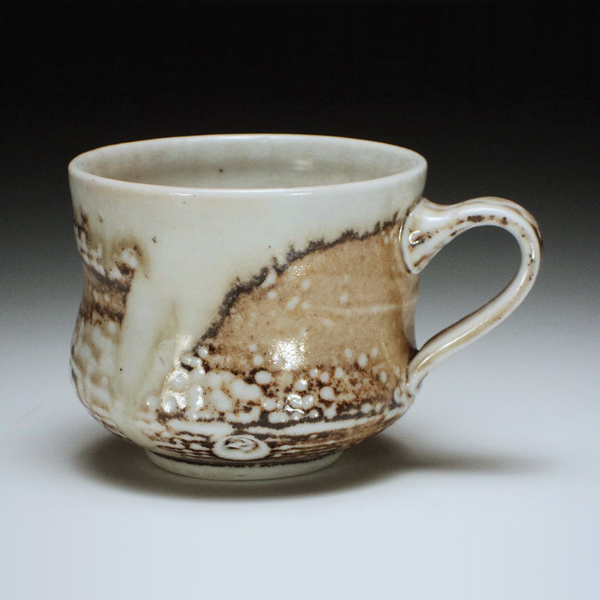 Wheel-thrown mug, ceramic, reduction fired.