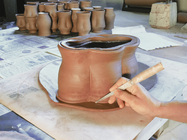 8 Cut a slab for the base of the jar, then slip, score, and attach it to the bottom of the form.