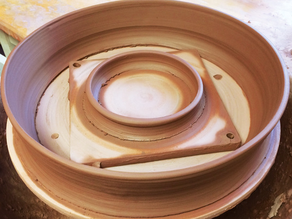 Range of Pottery Molds on a Wooden Shelf in Potters Studio. for