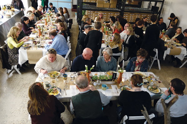 Gathered at Heidi’s Jam Factory, 42 diners enjoy a four-course meal on 10 in. (25 cm) dinner plates and accompanying 8-ounce bowls, along with mugs, vases and table garnishes, 2017.