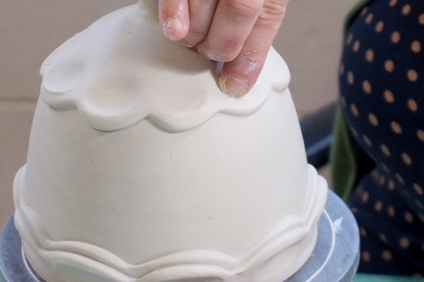 9 Press your finger into each scallop to create a concave area for the glaze to collect.