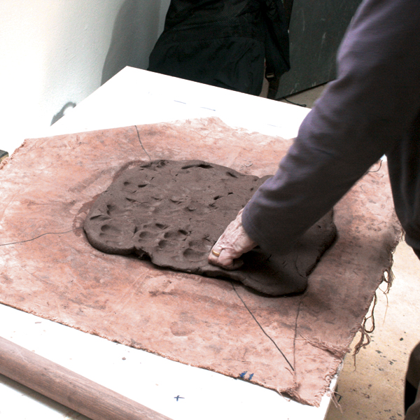 1 Take a loose-formed lump of grogged terra cotta and press it out gently, making a nice outline.