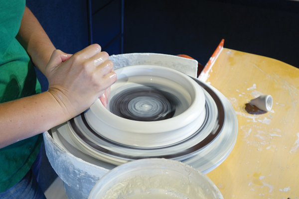 1 Use 2½ pounds of clay to throw a bisque mold. Start by centering the clay and opening up all the way to the bottom.