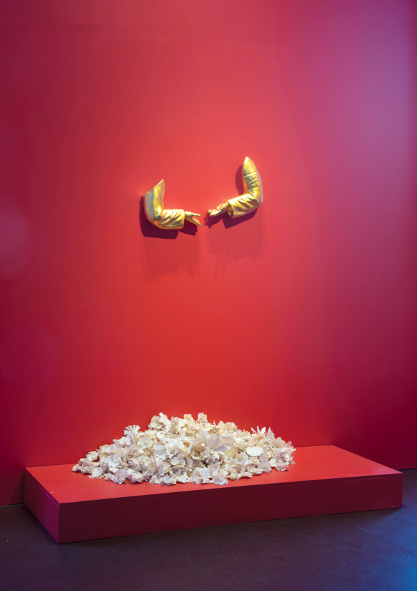 5 Mao’s Hand, 30 in. (76 cm) in width, porcelain, glaze, gold luster, CAFAM installation view. 