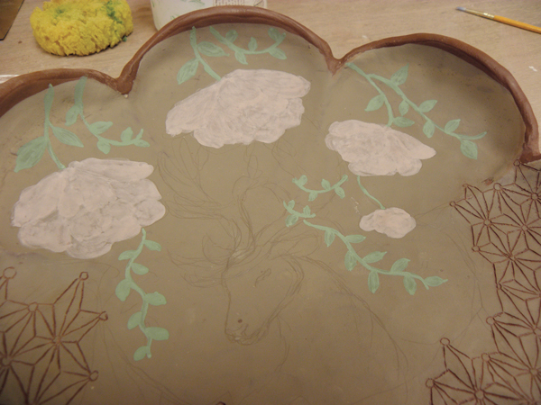 B Roughly paint in color fields for the floral elements, using layers of watered-down underglaze.