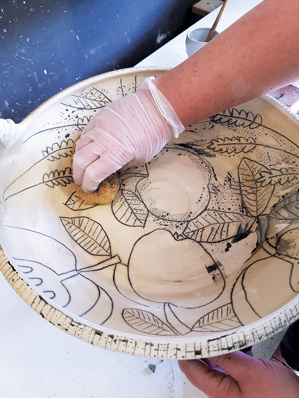 11 Wipe any excess underglaze away with a wet sponge, then bisque fire the tray after it’s fully dry.