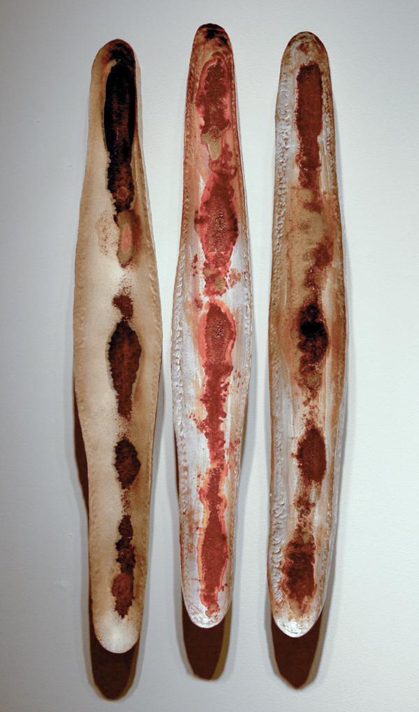 1 Rhonda Willer’s Lean Vessels, 3 ft. (1 m) in length, handbuilt on bisque molds, red earthenware, terra sigillata, granular borax, soda fired to cone 03 in oxidation.