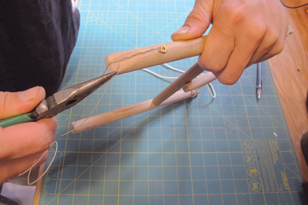 7 Wrap the wire around the brass screw and back around its self to ensure the wire stays tight.