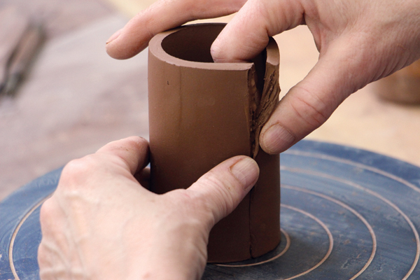 10 Using a template, cut out the shaker bodies. Cut, bevel, and score the edges, then form the slabs into cylinders.