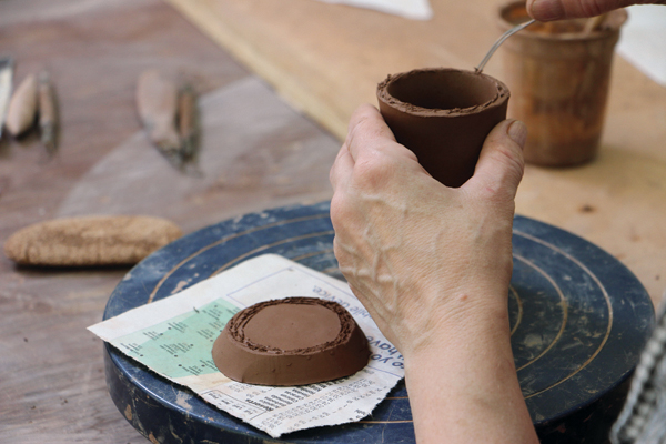 12 Push out to give the shakers some volume. Then, attach the double-slab bases to the shaker cylinders.