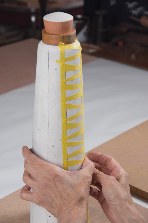18 Cut FrogTape or masking tape into patterns and apply to the surface as a resist.