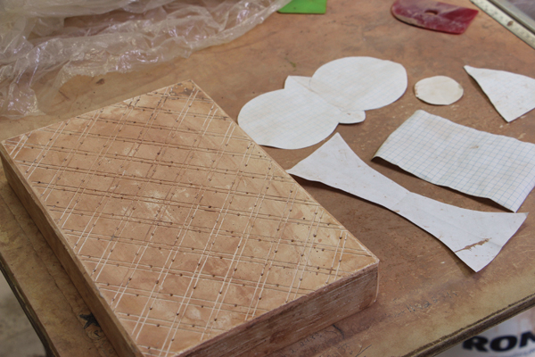 1 Use paper templates for the component parts and plaster with incised patterns for the surface decoration.