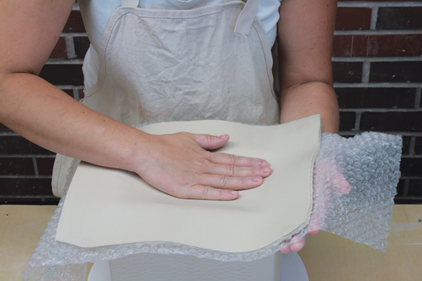 5 Flip the slab over and place it on the large box with the bubble wrap still attached.