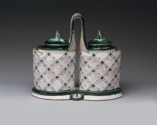 Katrina Chaytor’s handbuilt salt and pepper set, earthenware, slips, glazes, circuitry basket weave decoration.