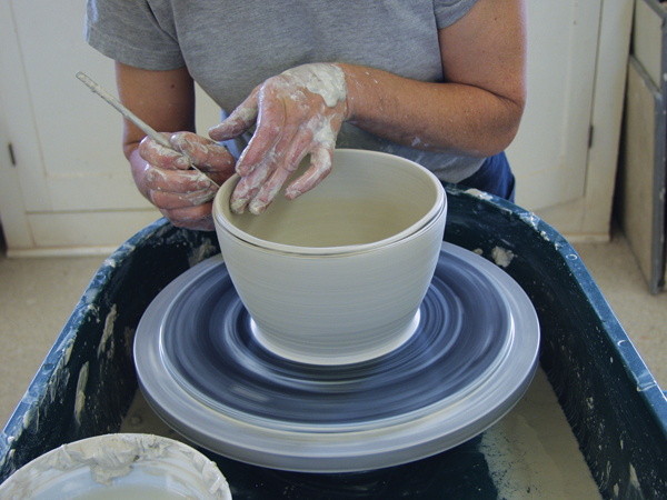 1 Center 5 pounds of clay and throw a bowl with a wide, flat ¼-inch-thick bottom. Trim the rim at a downward angle.