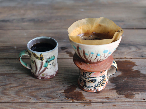 Pour over in action with Ron Meyers’ mug, 7 in. (18 cm) in height, Meyers’ mug: earthenware, electric fired to cone 04, 2006; Dondero pour over, 2009; Dondero mug (left), 2017.