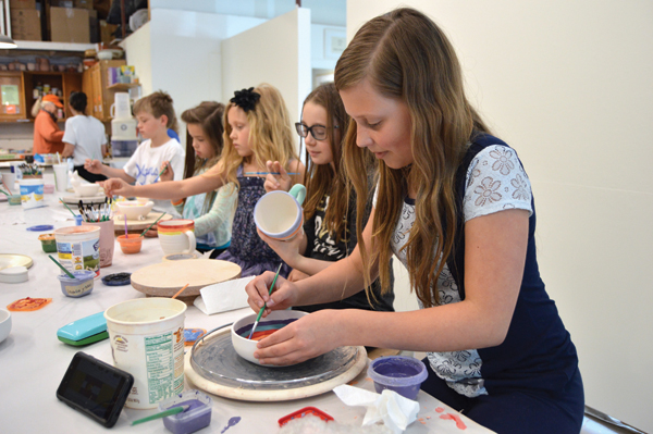 3 The center hosts a variety of events and classes for children, including a series called Glaze Daze, that invites kids to paint bisqueware that will later be clear glazed and fired. Photo: Jessica Cabe.