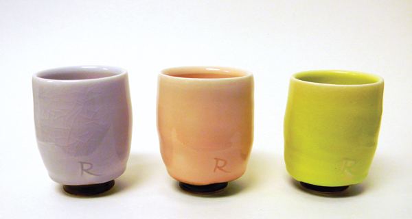 2 From left to right: A yunomi with WTF Purple glaze, a 7% neodymium oxide glaze; a yunomi with Sorority Pink glaze, an 8% erbium oxide glaze; a yunomi with Nucular Green glaze, a 7.5% praseodymium oxide glaze.