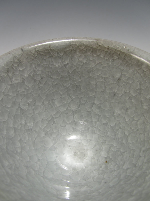 Detail of a bowl with Snowflake Crackle 1234 on Orangestone clay, fired to cone 10 in reduction.