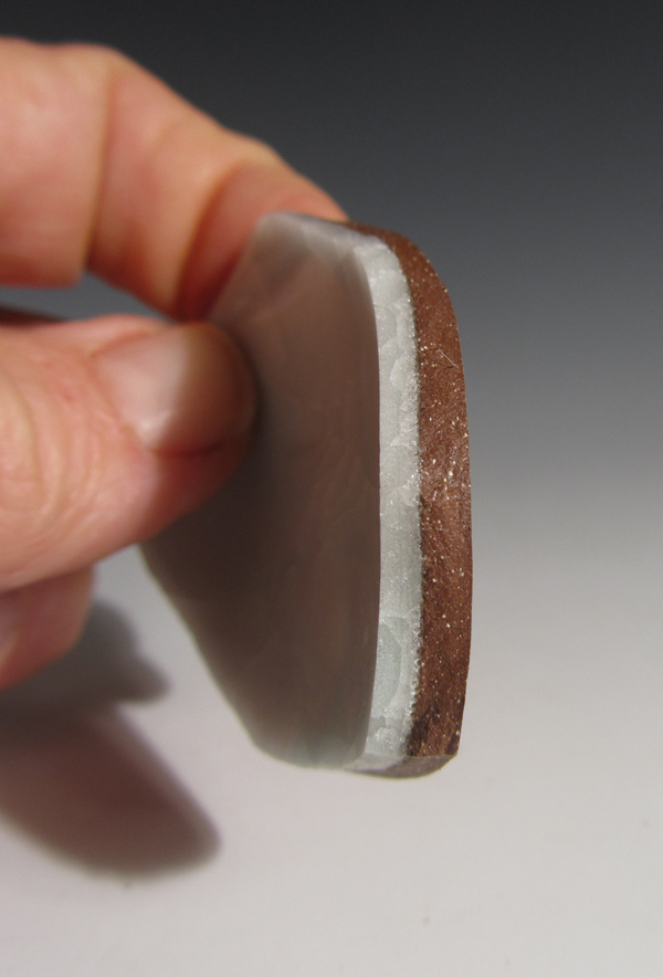 3 Side view of cracked bowl showing thickness of fired glaze versus the thickness of the clay body. Glaze thickness is 1/8–3/16 of an inch thick after being fired.