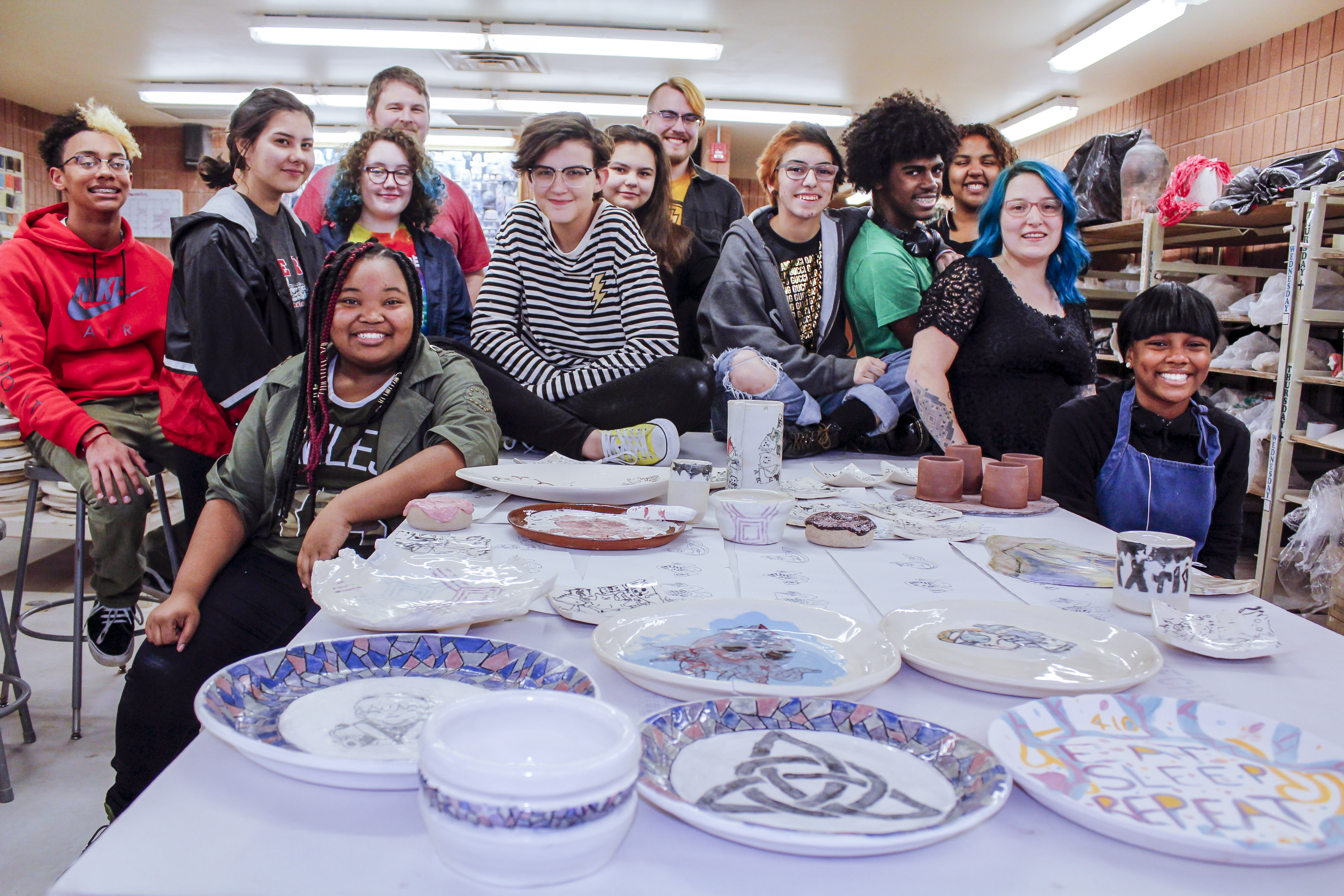 Talon Smith (second from right) and Ben Pyles (back row, center) with students in Manchester Craftsmen’s Guild’s after-school program.