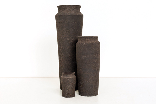 13 Film still of
Unknown Fields Division’s Rare Earthenware vases, to 19 in. (49 cm) in height, black stoneware and radioactive mine tailings, 2014–15. The finished vases
are made from the exact amount of toxic waste produced in the manufacture of three different objects of technology (smart phone (380g), laptop (1220g),
electric-car battery (2660g)).