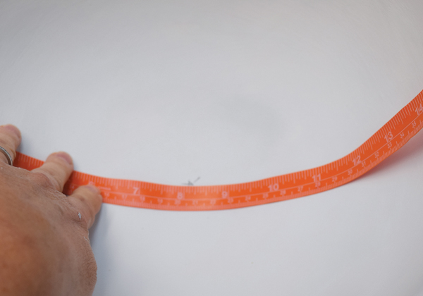 1 Find the center by draping a fabric ruler from rim to rim.