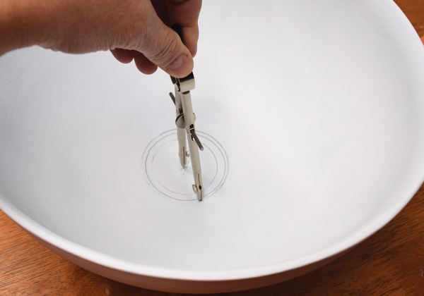 2 Use a compass to draw concentric circles at the bottom of the bowl.